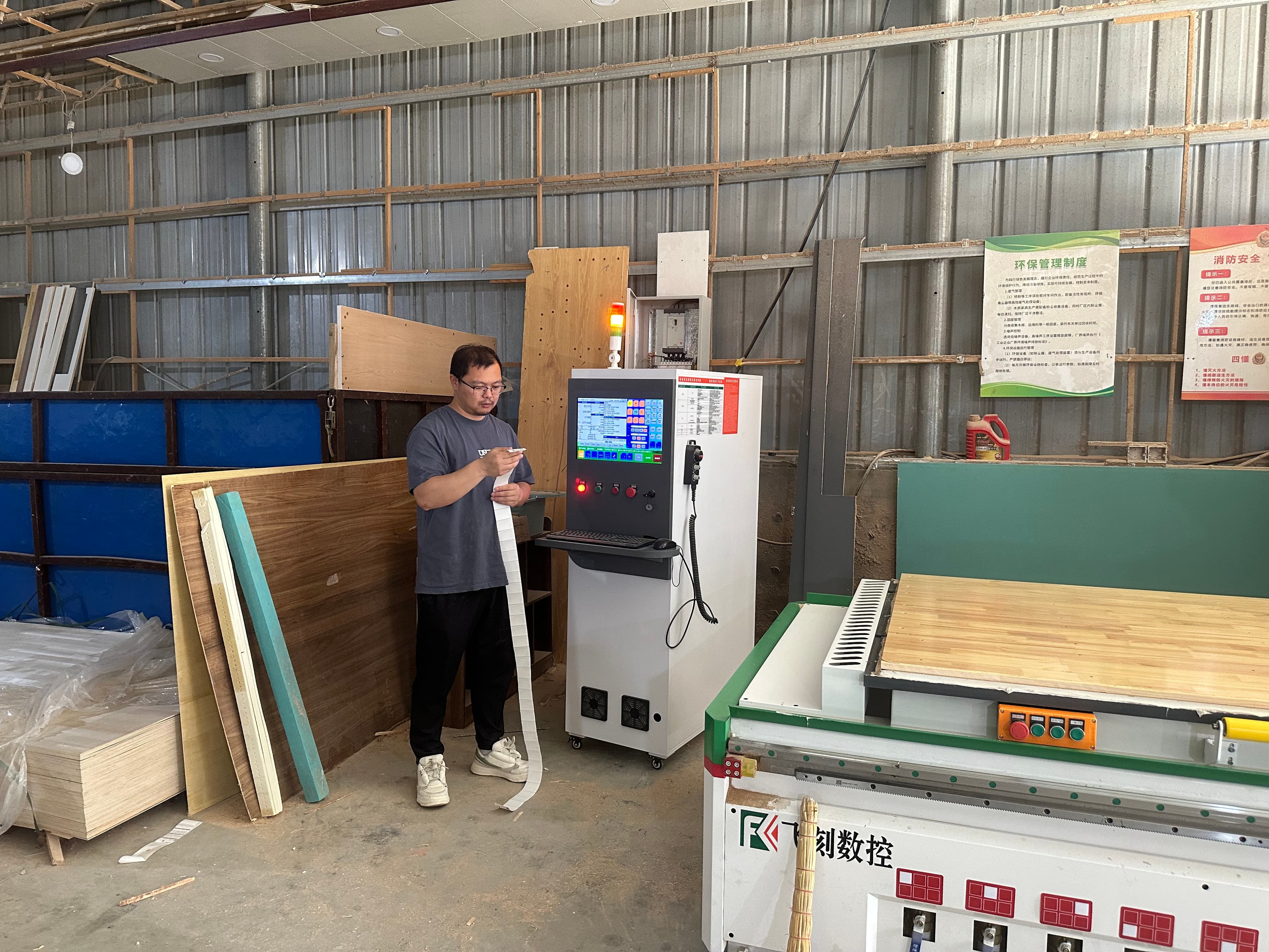 Evan Yang reviewing production specs on the factory floor in Shaji, Xuzhou